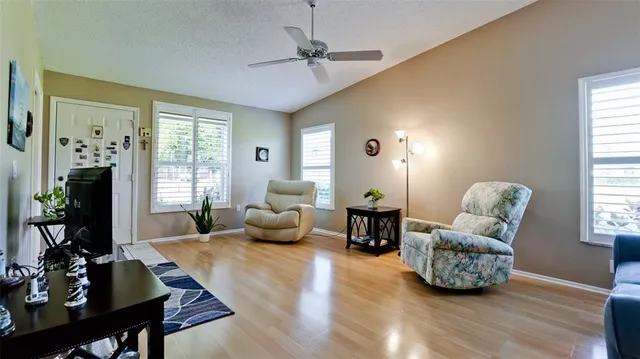 a living room with furniture or couch and a wooden floor