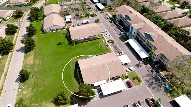 an aerial view of a house with outdoor space and lake view