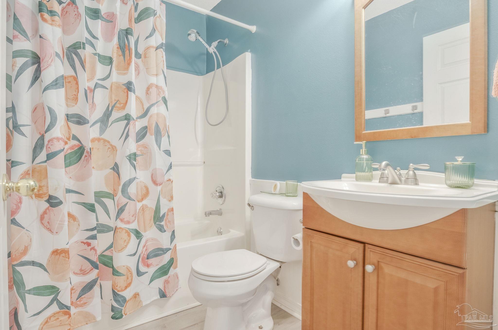 5539 Windrun Place Pace, FL 32571 - Photo 19 of 62 a bathroom with a sink toilet and shower