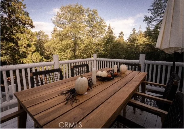 a view of a balcony with wooden floor