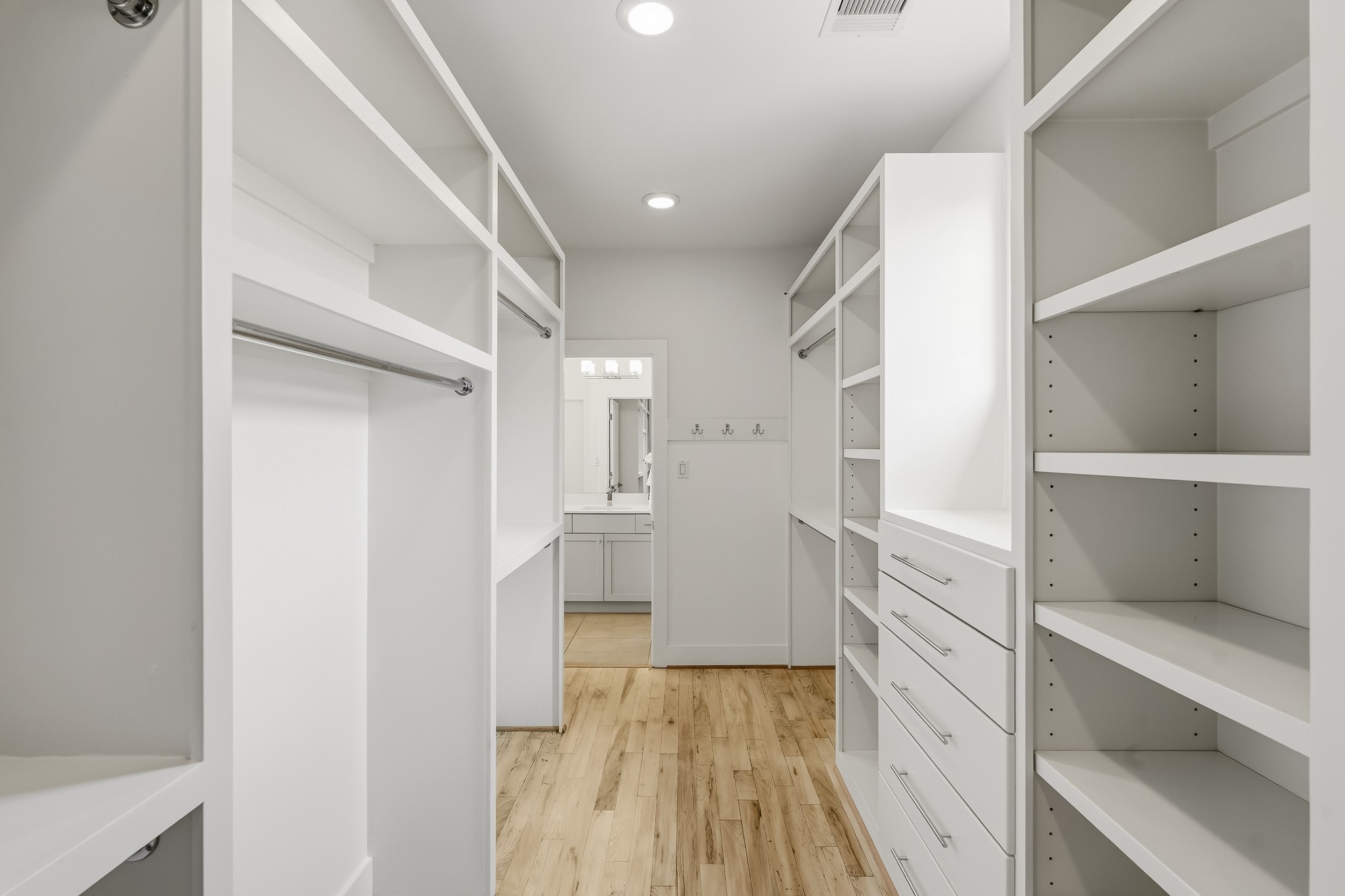 2004 Rosedale Street, Unit D Houston, TX 77004 - Photo 31 of 45 Another view of the custom walk-in closet highlights the built-in cabinetry, generous shelving, and hanging spaces for your complete wardrobe.