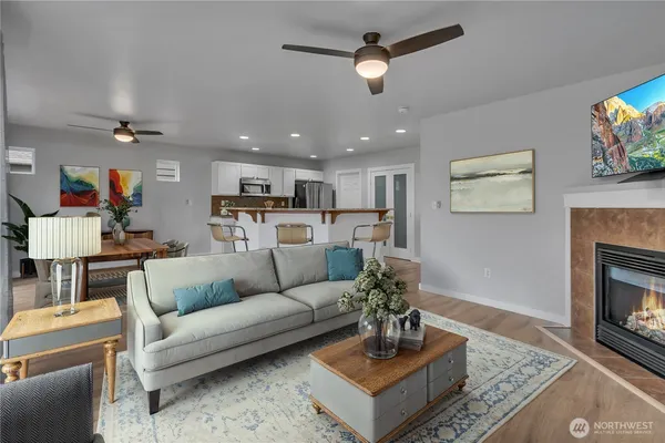 a living room with furniture and a fireplace