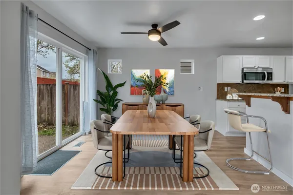 a view of a dining room with furniture window and outside view
