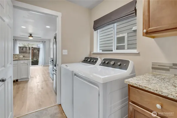 a utility room with washer and dryer