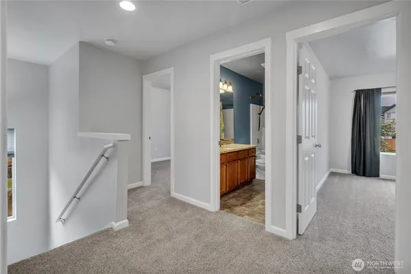 a view of a hallway with a room