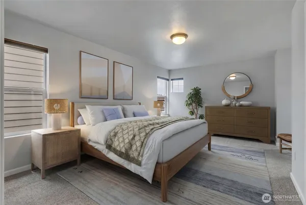 a bedroom with a bed window and a mirror