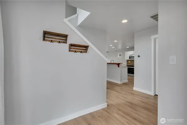 a view of kitchen with wooden floor
