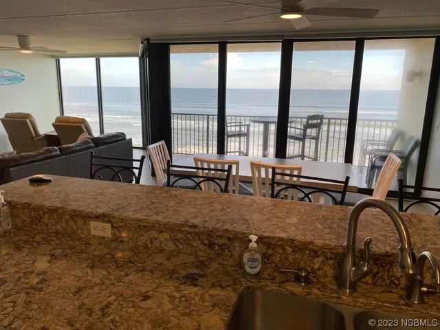 a kitchen with granite countertop a stove and a microwave