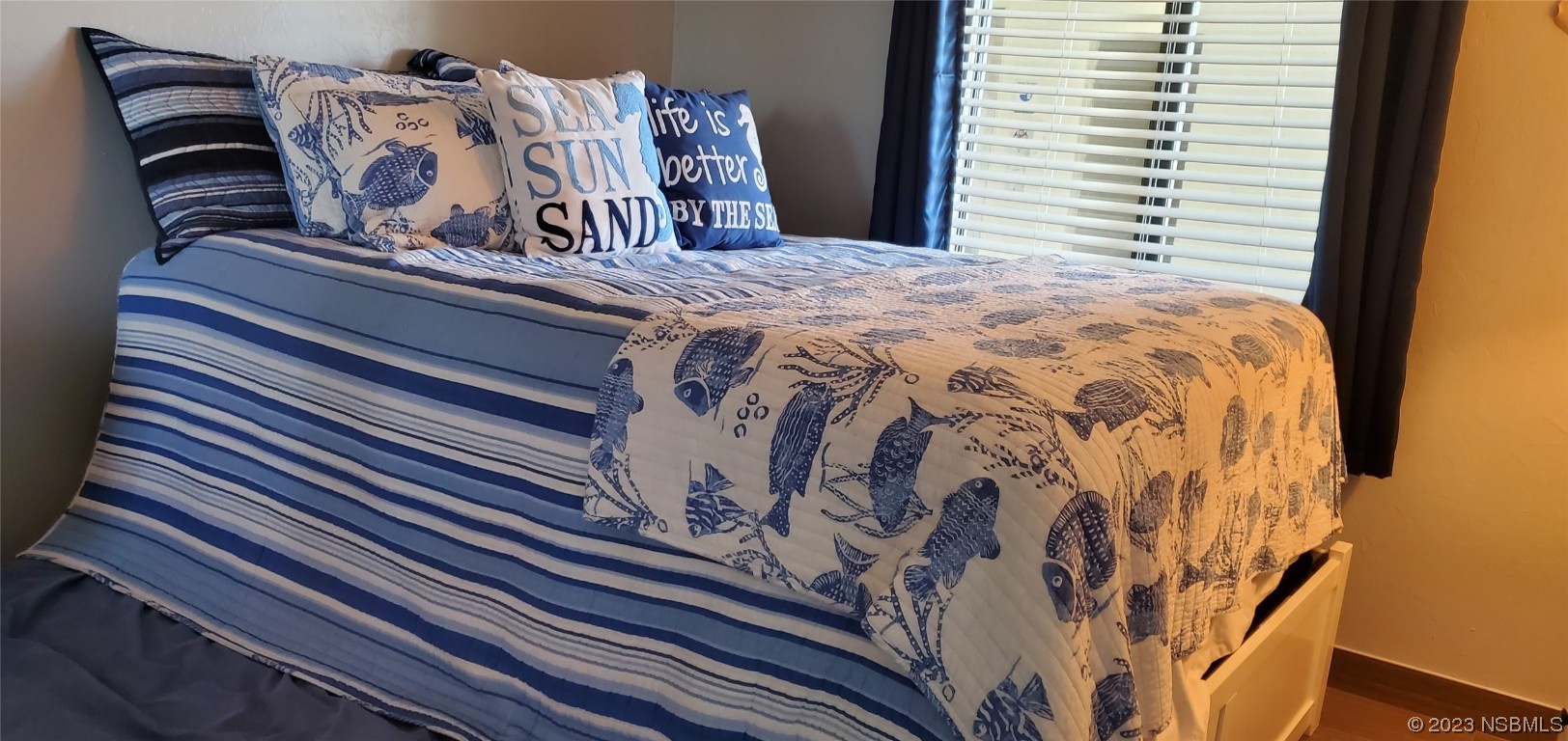 6727 Turtlemound Road, Unit 416 New Smyrna Beach, FL 32169 - Photo 23 of 67 a bedroom with a bed and a window