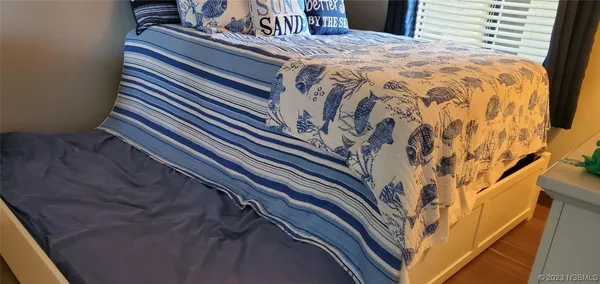 a view of a chairs and table in the balcony