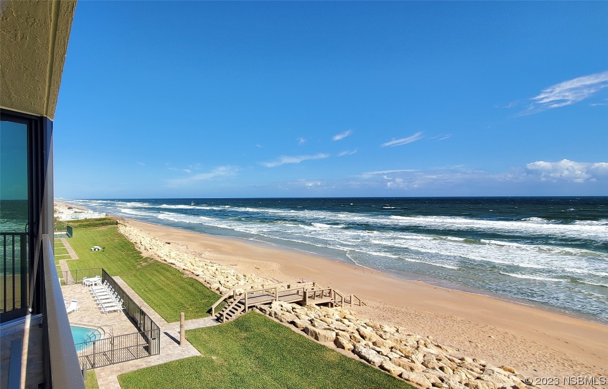 6727 Turtlemound Road, Unit 416 New Smyrna Beach, FL 32169 - Photo 3 of 67 a view of an ocean and beach