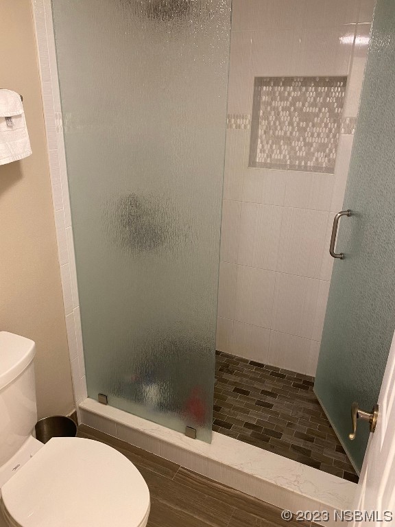 6727 Turtlemound Road, Unit 416 New Smyrna Beach, FL 32169 - Photo 34 of 67 a bathroom with a toilet and a shower