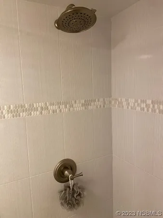 a bathroom with a shower a toilet and a sink