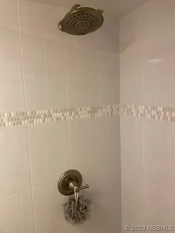 a bathroom with a shower a toilet and a sink