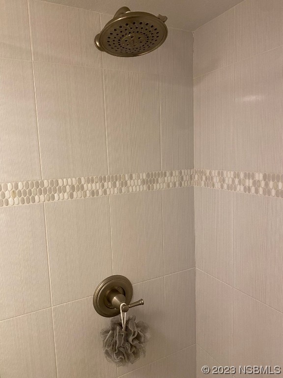 6727 Turtlemound Road, Unit 416 New Smyrna Beach, FL 32169 - Photo 35 of 67 a bathroom with a shower