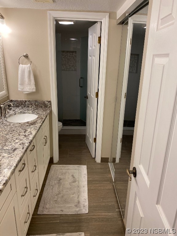 6727 Turtlemound Road, Unit 416 New Smyrna Beach, FL 32169 - Photo 37 of 67 a spacious bathroom with a granite countertop sink and a mirror