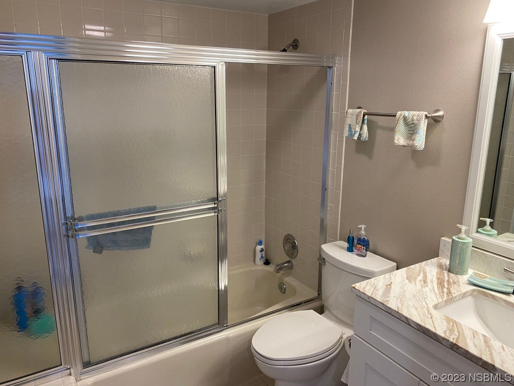 6727 Turtlemound Road, Unit 416 New Smyrna Beach, FL 32169 - Photo 40 of 67 a bathroom with a shower a toilet and a sink