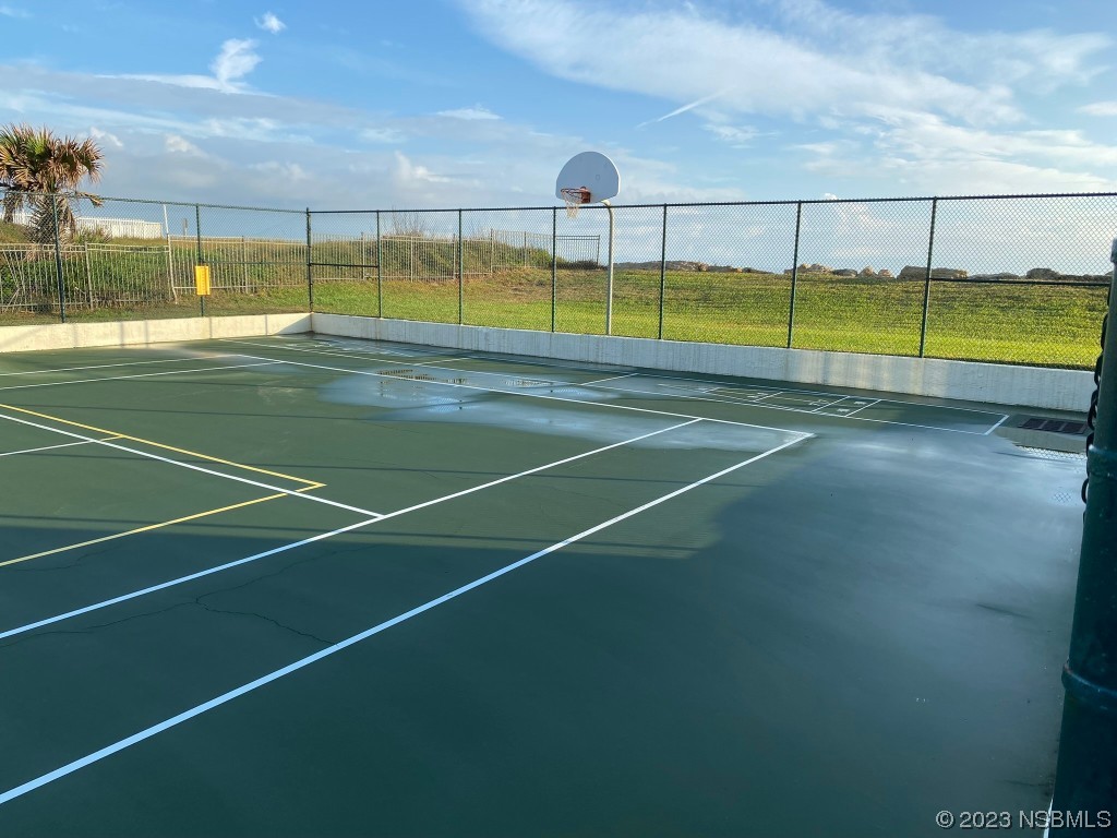 6727 Turtlemound Road, Unit 416 New Smyrna Beach, FL 32169 - Photo 56 of 67 a view of an outdoor space and tennis court