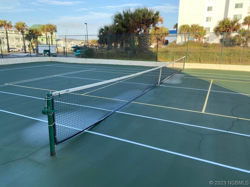 6727 Turtlemound Road, Unit 416 New Smyrna Beach, FL 32169 - Photo 57 of 67 a view of an outdoor space and tennis court