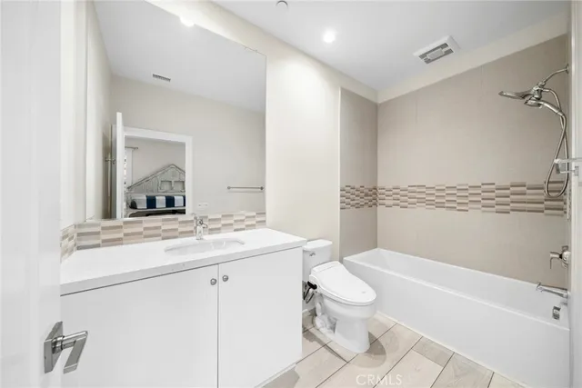 a bathroom with a sink a toilet and a bathtub