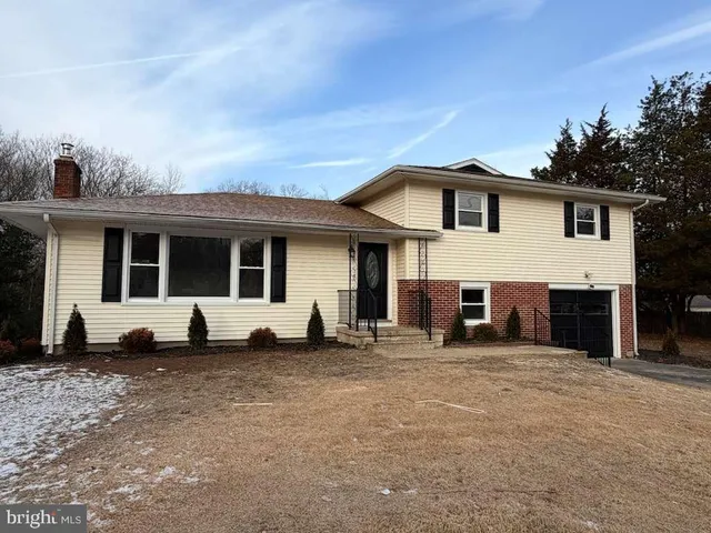 a view of a house with a large window and a view of house