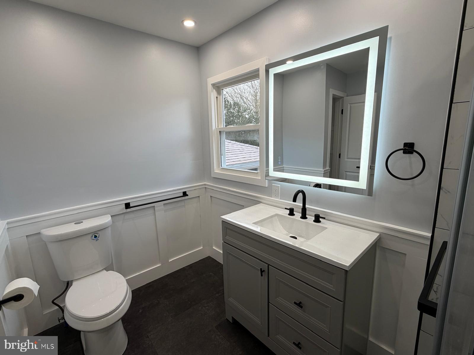 24 Rieck Avenue Millville, NJ 08332 - Photo 22 of 57 a bathroom with a sink toilet and mirror