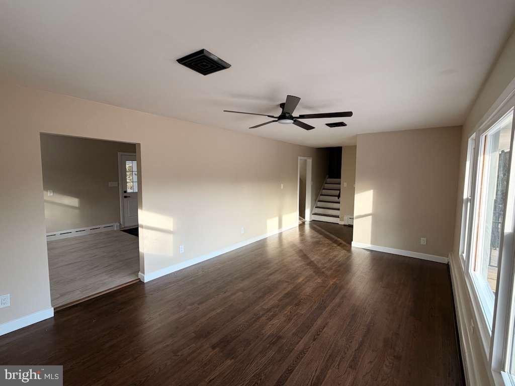 24 Rieck Avenue Millville, NJ 08332 - Photo 6 of 57 a view of an empty room with wooden floor and a window