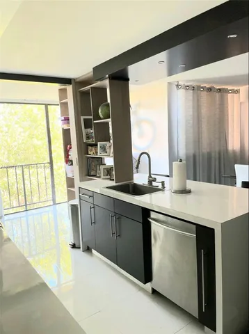 a spacious bathroom with a double vanity sink and a large mirror