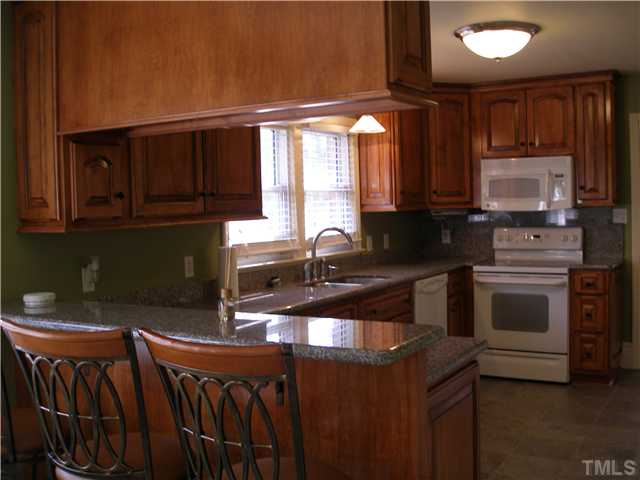 4119 Rock Quarry Road Raleigh, NC 27610 - Photo 5 of 12 What's for dinner? You'll love preparing meals in this well appointed kitchen.