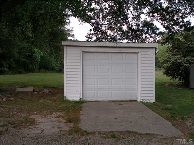 4119 Rock Quarry Road Raleigh, NC 27610 - Photo 10 of 12 Park your car, or use for additional storage in this one-car detached garage.