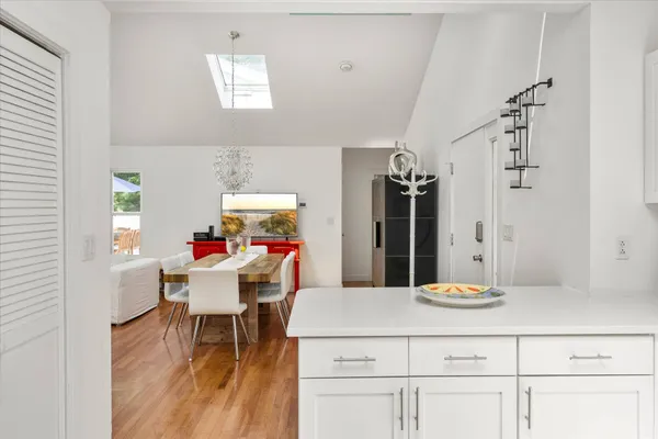a kitchen with a table and chairs in it