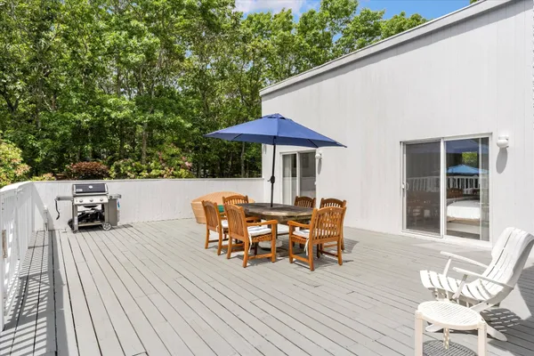 an outdoor space with furniture and umbrella