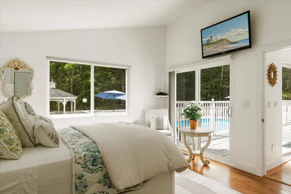 a bedroom with furniture and a window