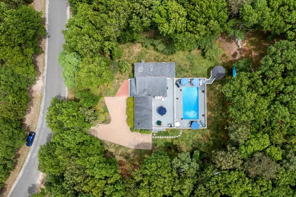an aerial view of a house with a garden