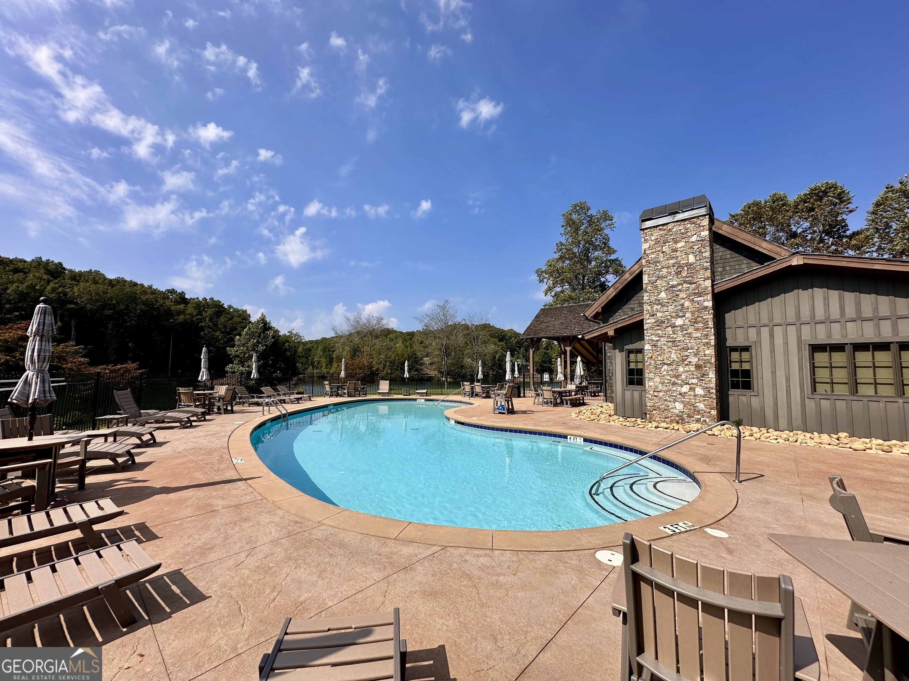 0 Forked Leaf Road, Unit 29 Cleveland, GA 30528 - Photo 36 of 39 a swimming pool with outdoor seating