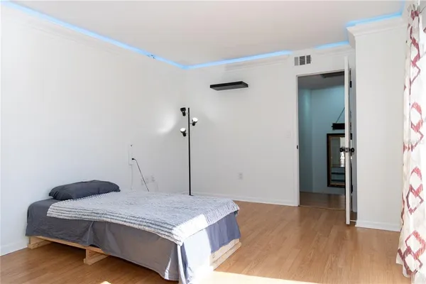 a bedroom with a bed and a table