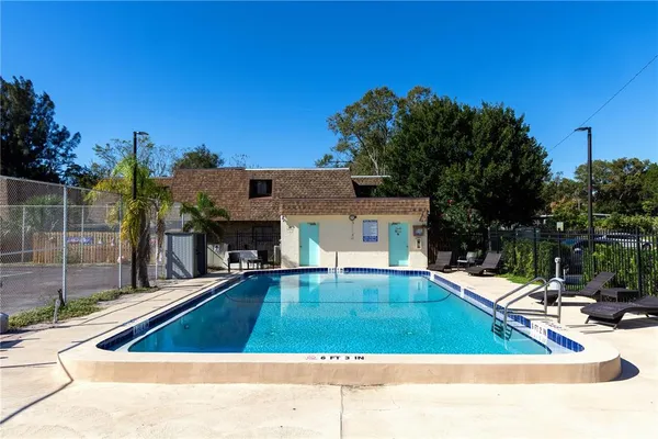 a view of swimming pool with chairs