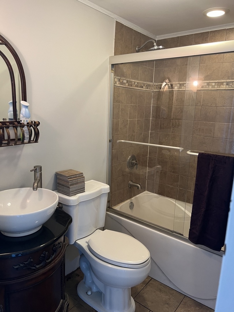 207 Second Street Elgin, IL 60123 - Photo 16 of 23 a bathroom with a sink toilet and shower