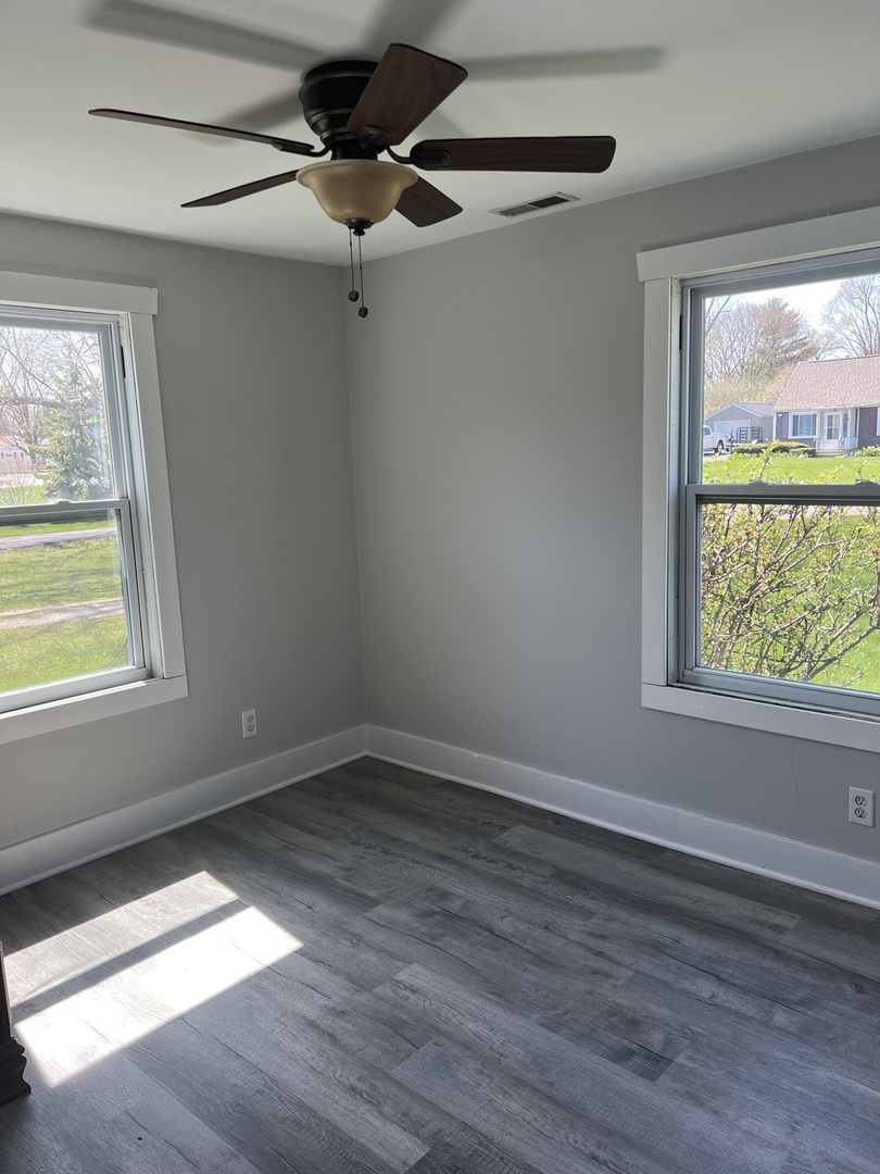 207 Second Street Elgin, IL 60123 - Photo 18 of 23 a view of empty room with wooden floor and fan