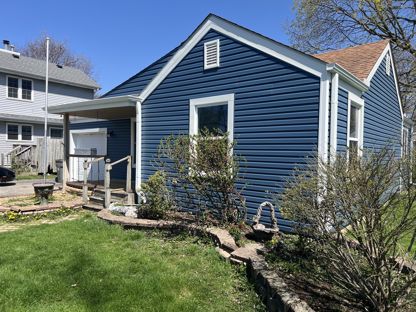 207 Second Street Elgin, IL 60123 - Photo 2 of 23 a front view of a house with a yard