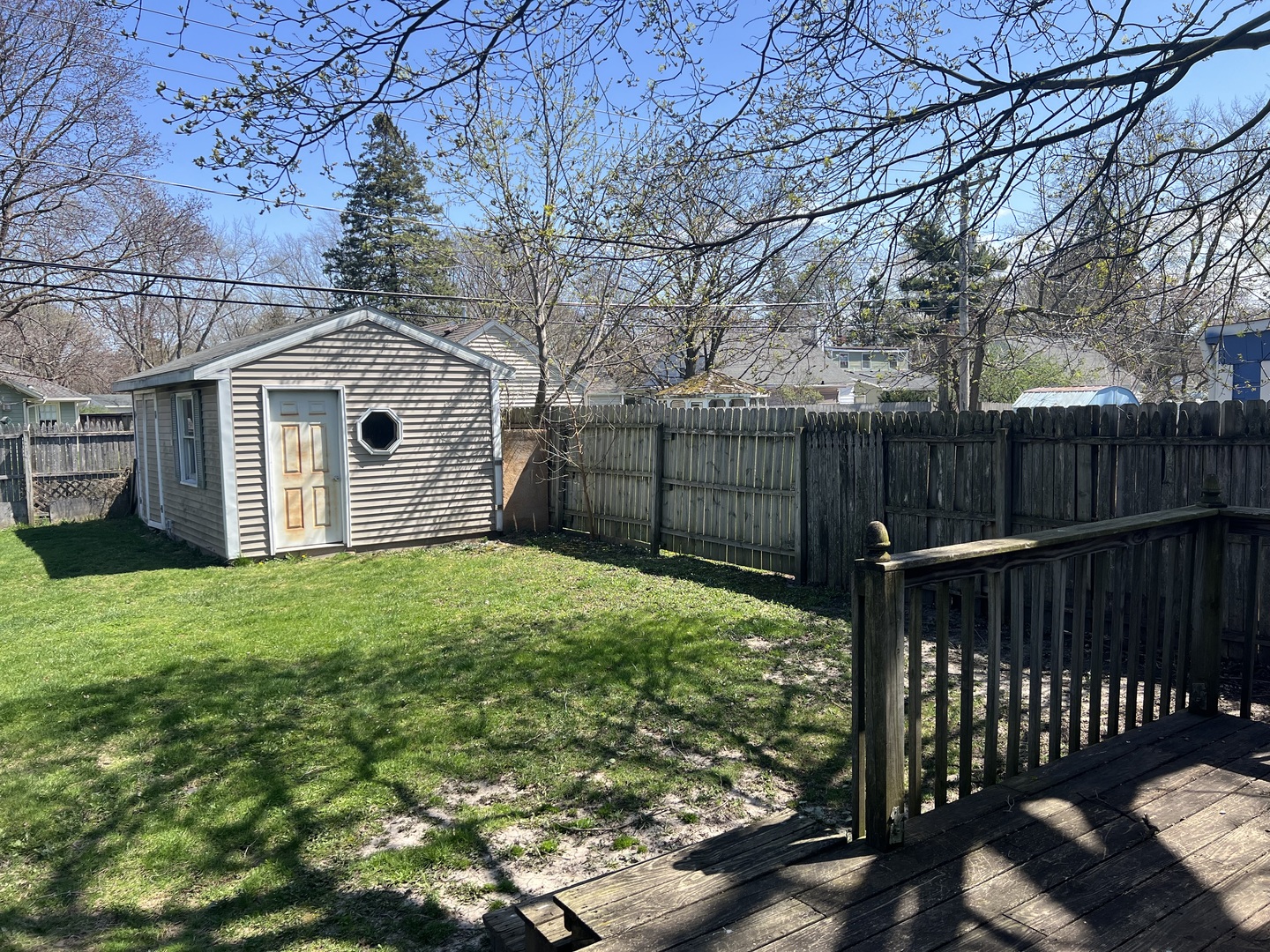 207 Second Street Elgin, IL 60123 - Photo 21 of 23 a view of a backyard with a garden and deck