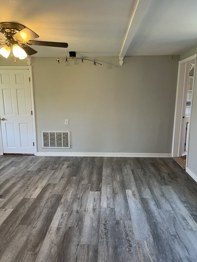 207 Second Street Elgin, IL 60123 - Photo 6 of 23 a view of empty room with wooden floor