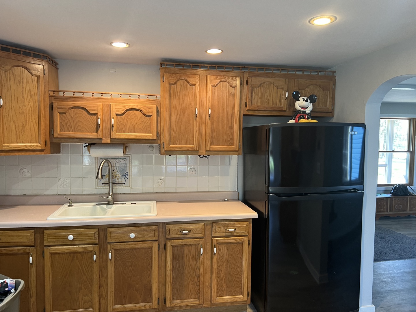 207 Second Street Elgin, IL 60123 - Photo 10 of 23 a kitchen with a refrigerator and a sink