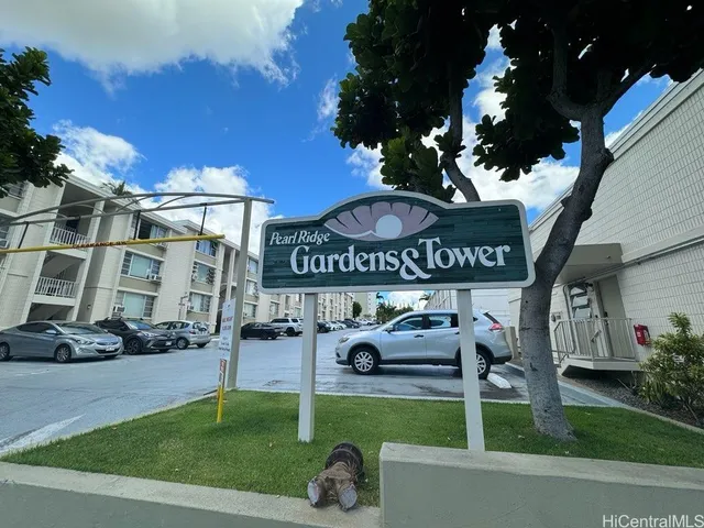a front view of a building with parking space