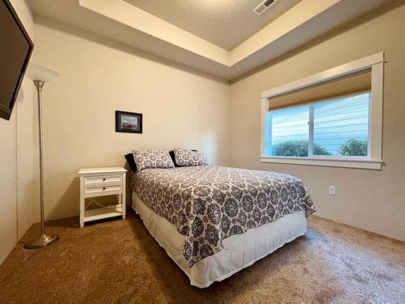 1078 North Haskell Street Central Point, OR 97502 - Photo 17 of 25 a bedroom with a bed and a window