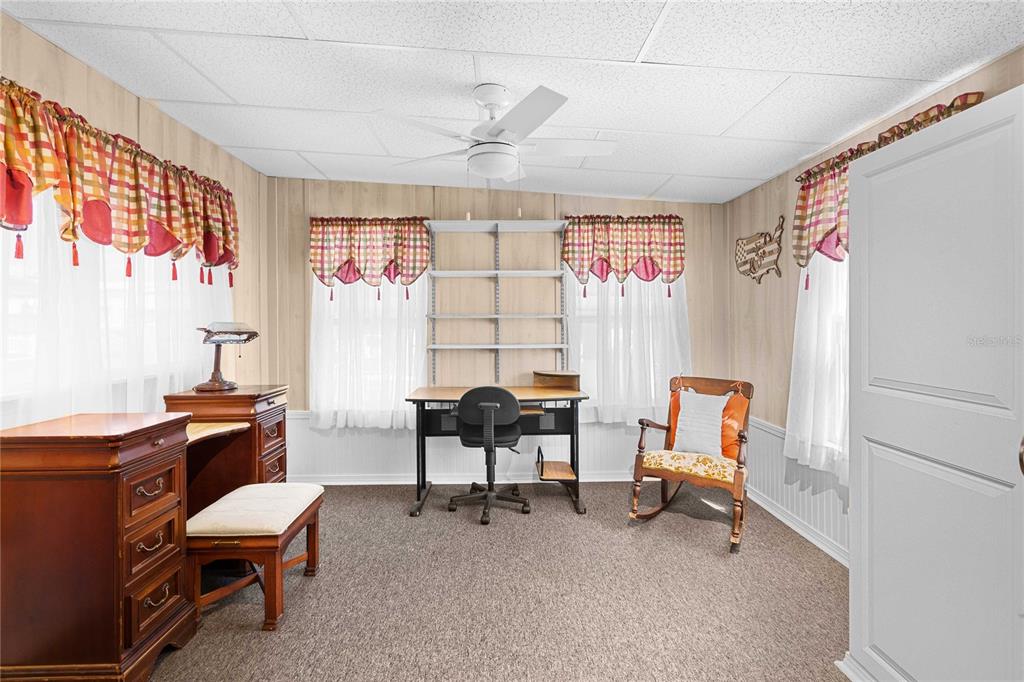 7135 El Dewitt Street Zephyrhills, FL 33541 - Photo 16 of 46 a living room with furniture and a window