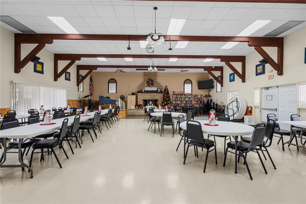 7135 El Dewitt Street Zephyrhills, FL 33541 - Photo 26 of 46 a view of a dining room with furniture and chandelier