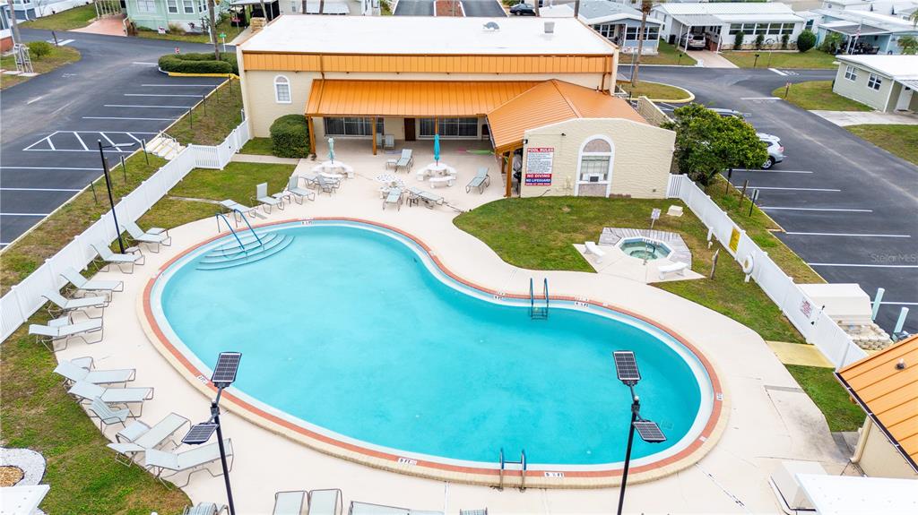 7135 El Dewitt Street Zephyrhills, FL 33541 - Photo 30 of 46 an aerial view of a swimming pool