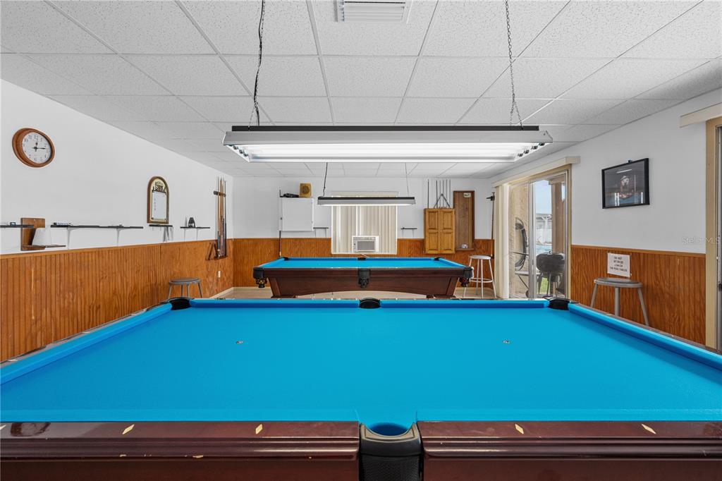 7135 El Dewitt Street Zephyrhills, FL 33541 - Photo 38 of 46 a room with pool table and windows