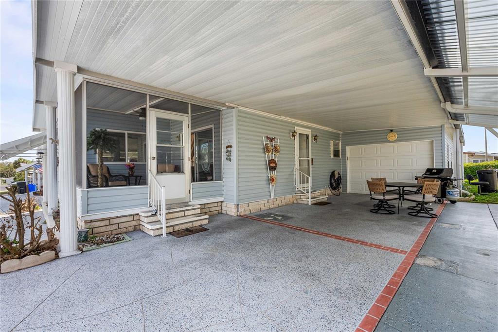7135 El Dewitt Street Zephyrhills, FL 33541 - Photo 6 of 46 a wooden bench sitting in front of a building